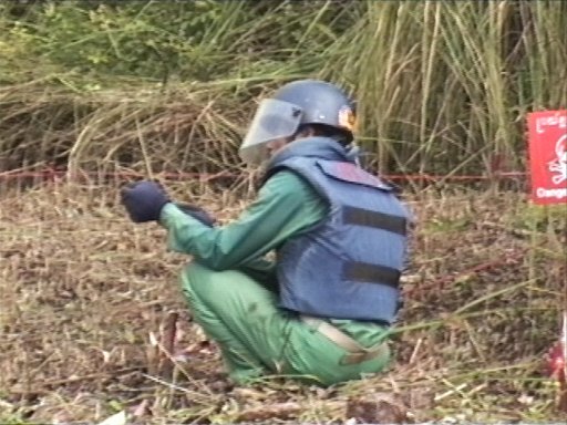 deminer looking beneath visor